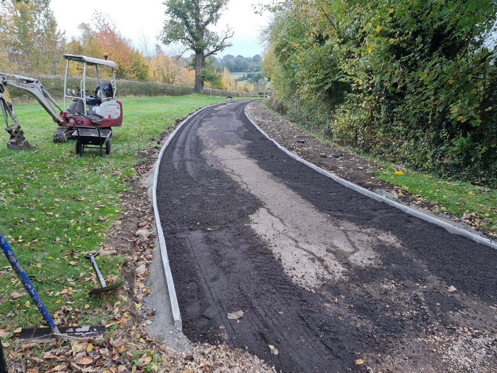 This is a large driveway which is in the process of having a tar and chip driveway installed on by NS Driveways Ashtead