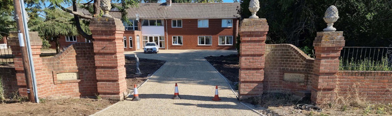 This is a photo of a newly installed chip and tar driveway, installed by NS Driveways Ashtead
